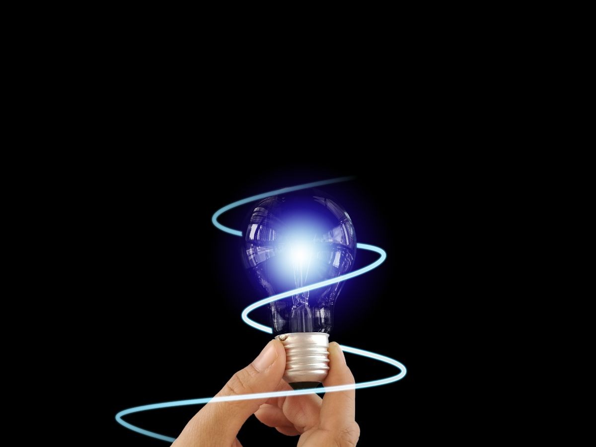 Transparency Light Bulb on isolated black empty space background for creative innovation and smart future idea for  business strategy. The glowing light inspire intelligence innovation solution 