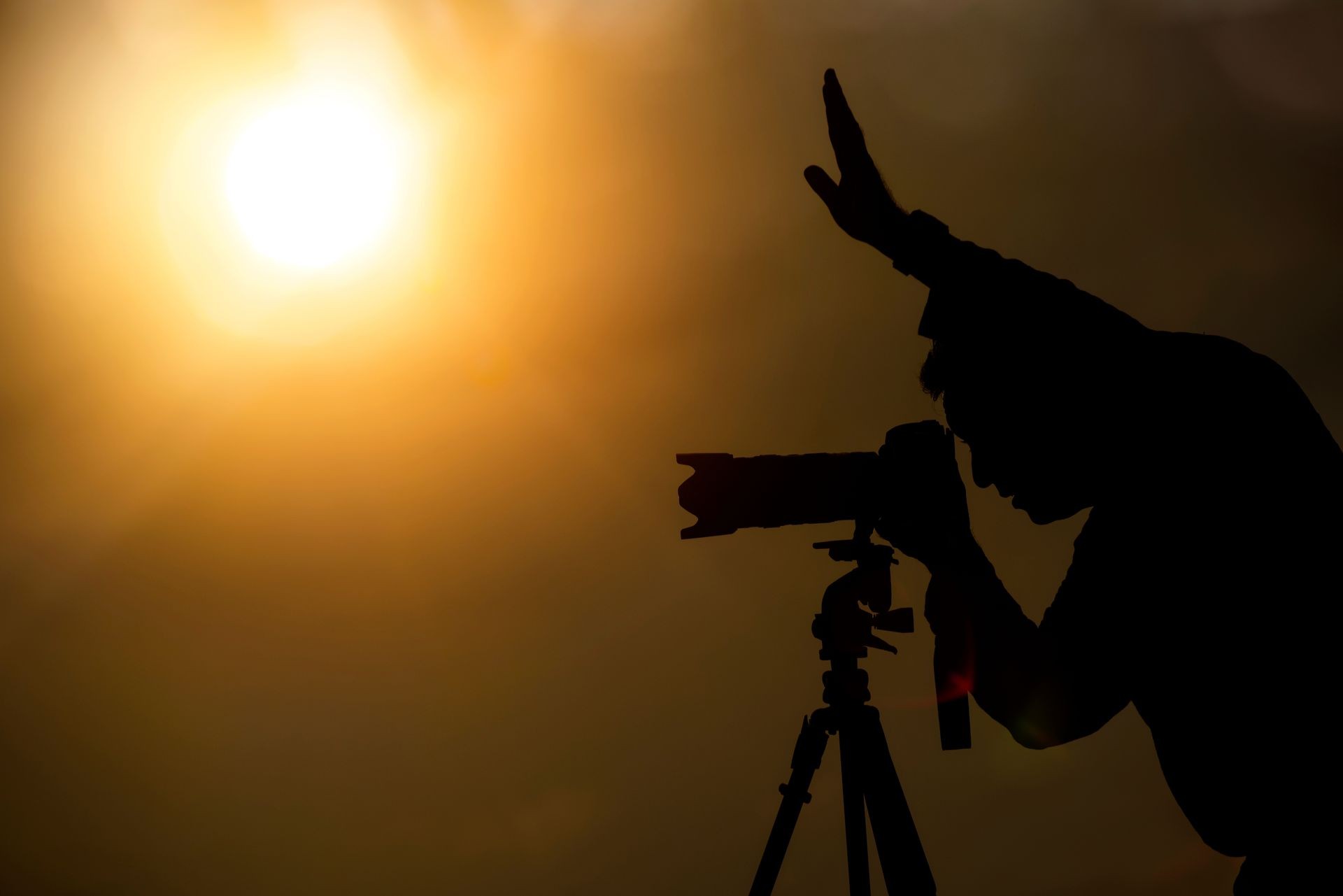 Silhouette of photographer taking pictures